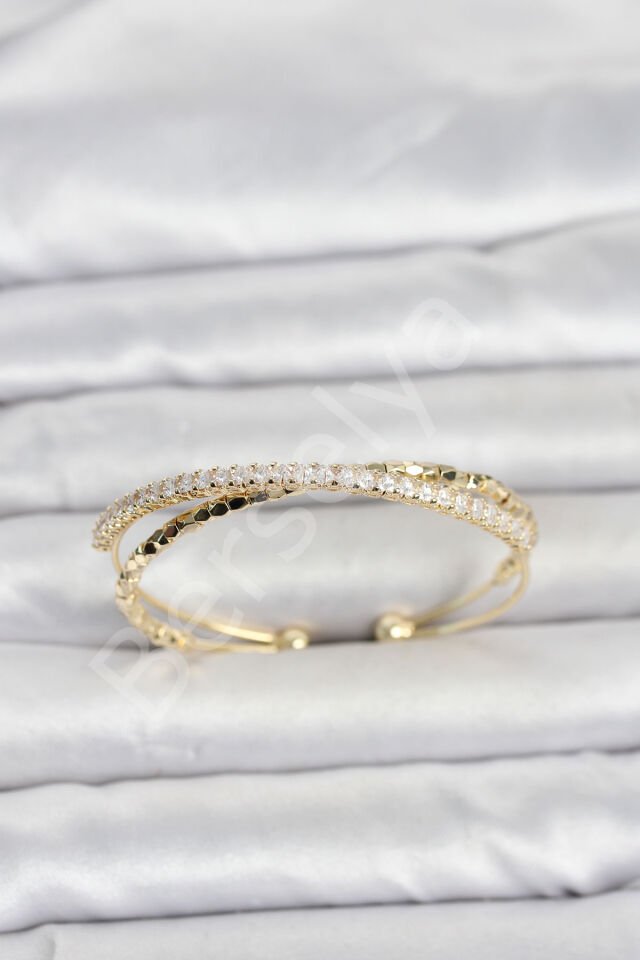 Pirinç Gold Renk Zirkon Taşlı ve Dorika Model Kadın Bileklik